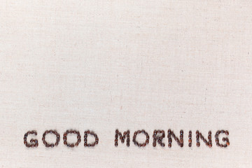 Good morning letter sign from coffee beans isolated bottom on linea canvas.