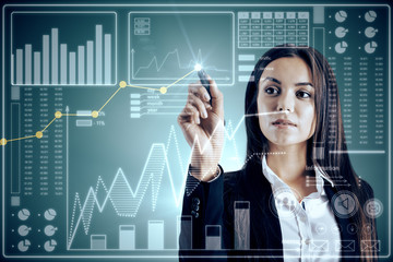 Pretty young businesswoman with business interface