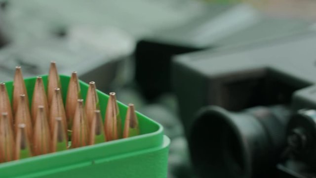 Sniper rifle. Position for shooting. Slow motion. 4K. Close Up.