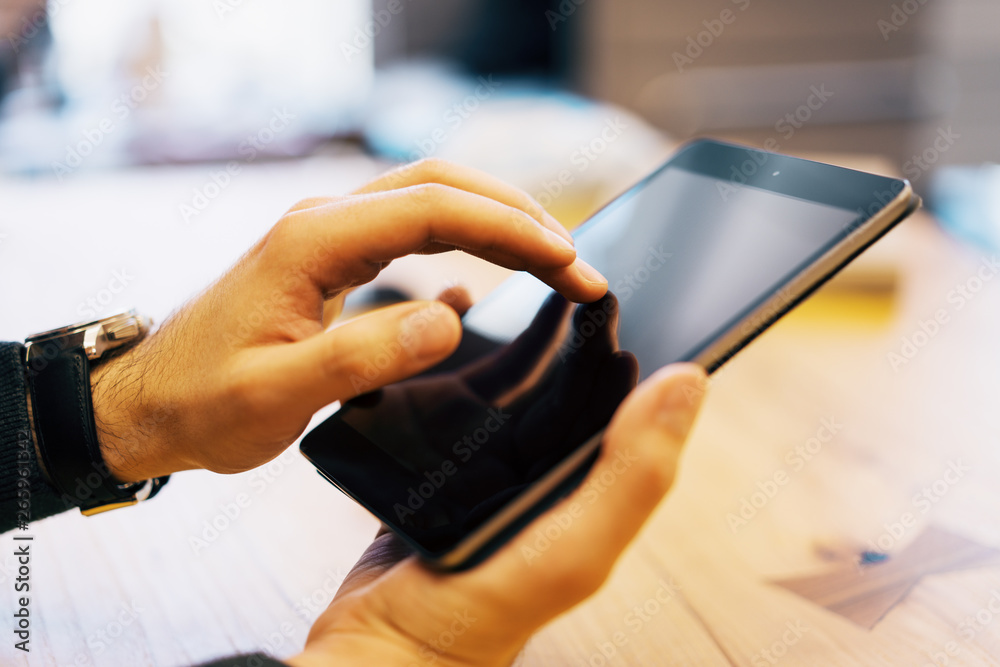 Poster sideview of man using touchpad
