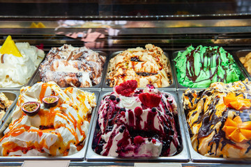 Ice cream in Rome, Italy. Italian gelateria. Ice-cream cafe, show window with sweeties.