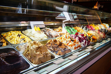 Ice cream in Rome, Italy. Italian gelateria. Ice-cream cafe, show window with sweeties.