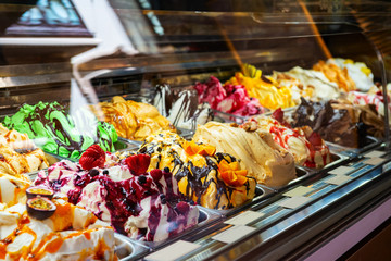 Ice cream in Rome, Italy. Italian gelateria. Ice-cream cafe, show window with sweeties.