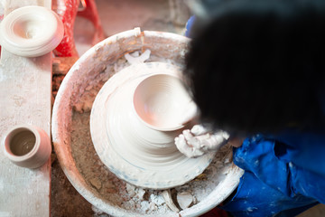 Making a vase in  a pottery workshop