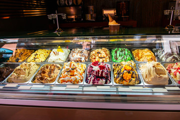 Ice cream in Rome, Italy. Italian gelateria. Ice-cream cafe, show window with sweeties.