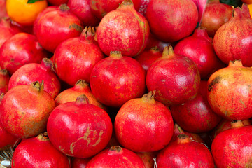 Pomegranates on market in Italy. Agricultural food. Fresh organic products. © Khorzhevska