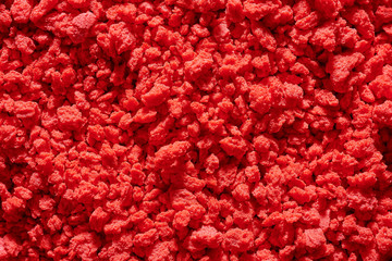Red background structure. Colored crumbs