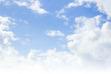 Naklejka na ściany i meble Blue sky background and white clouds in the air.