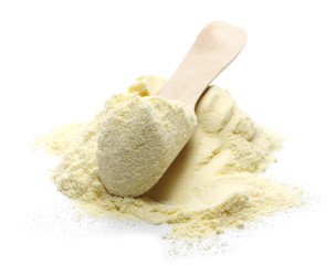 Pile corn flour in wooden spoon isolated on white background