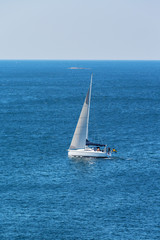 Sailboat sailing on a blue sea