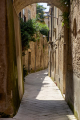 Fototapeta na wymiar Empty alley in the old town of Sant'Agata de' Goti, Campania, Italy