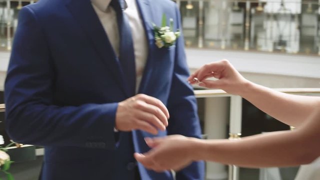 young couple in love newlyweds exchange gold wedding rings 1