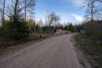 Fototapeta premium b eautiful countryside gravel road in sunset