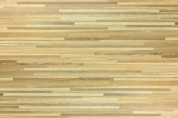 Hardwood maple basketball court floor viewed from above.