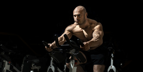 Fototapeta na wymiar Man bodybuilder perform exercise