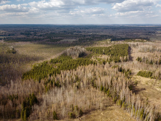aerial view of countryside fields and forests with small lakes