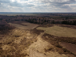 aerial view of countryside fields and forests with small lakes