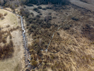 aerial view of countryside fields and forests with small lakes