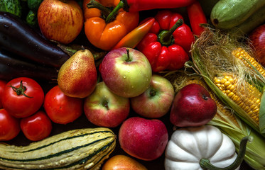 Assortment of fresh fruits and vegetables. Composition with assorted raw organic vegetables and fruits. Toned image.