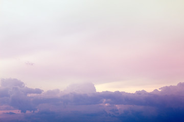 A soft fog cloud background with a pastel colored orange to blue gradient