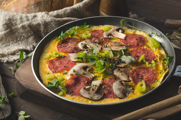 Fototapeta na wymiar Homemade delish egg omelette with salami