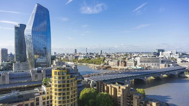 Aerial view of north bank of the river Thames, One Blackfriars tower and Blackfriars Railway Bridge in the foreground. Time lapse, London, UK.