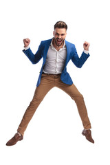 sexy man in suit celebrating victory and shouting