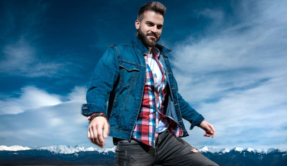 happy  man being satisfied by his trip in the outdoors
