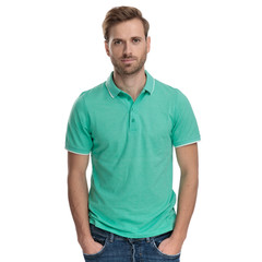 handsome man standing with hands in pockets