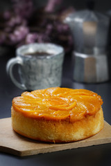 Still life photography of Peach cake on the table, shooting in studio. Popular dessert served with hot drink. Clean food concept.