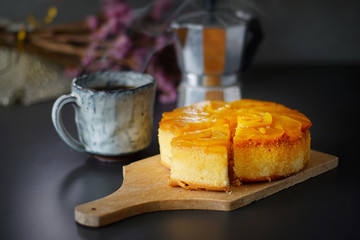 Still life photography of Peach cake on the table, shooting in studio. Dessert served with hot drink. Clean food concept.