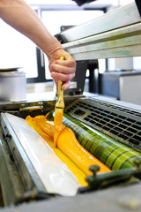 The printing process. The printer applies ink inks. 