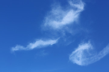Fototapeta na wymiar white cloud shape pipe cigarette and smoke on blue sky