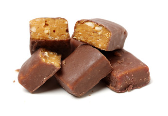 Chocolate peanut candy on white background