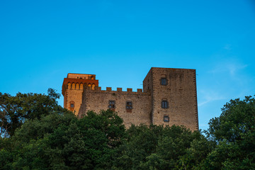Fototapeta na wymiar Medieval building of San Gimignano old town with towers, bright blue sky in the background, typical Italy and Tuscany countryside landscape.