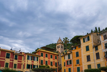 View of old cozy colorful houses in Portofino, Italy. Architecture and landmark of Liguria coast. Postcard of Portofino. Travel and vacation concept.