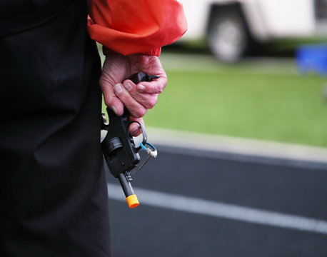 A Starter Gun Signals The Final Lap In A High School Track Meet