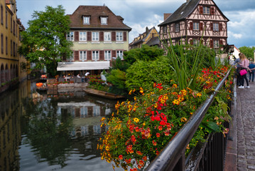 Cityscaspe view on the old town with beautiful half-timbered houses and crowded streets in Colmar, famous french town in Alsace region.