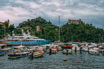 Fototapeta na wymiar Amazing colorful mediterranean landscape, fantastic panorama of Portofino touristic village on Liguria coast, Italy, Europe. Postcard of Portofino. Travel and vacation concept.
