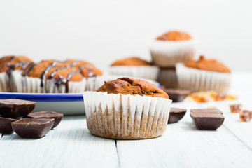 chocolate cupcakes, old white wooden table