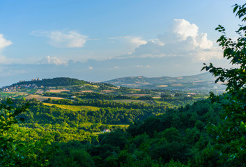 Fototapeta na wymiar Beautiful valley in Tuscany, Italy. Vineyards and landscape with San Gimignano town at the background. Tourism, travel in Italy. Beautiful destination Europe. Summer holiday outdoor vacation trip.