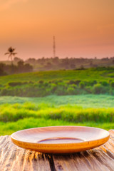 Wooden plate on old wooden table