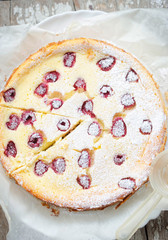 Raspberry cheesecake with icing sugar 