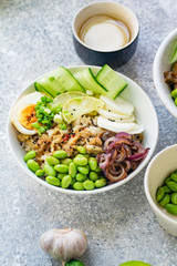 Vegetarian lunch bowl with marinated egg and edamame beans