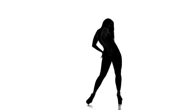 black silhouette on white background girl dancing modern dance, strip plastic
