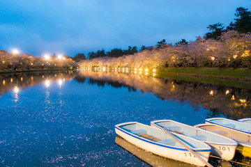 Fototapeta na wymiar Boat along West Moat of Hirosaki Park. Hirosaki Park is one of Japan's best cherry blossom spots at Aomori, Japan.