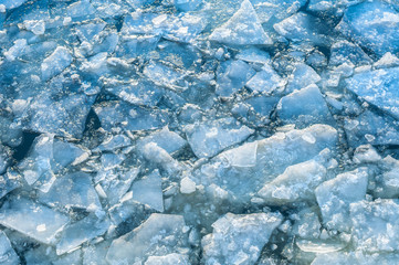 Ice blocks drifting in a cold river at winter.