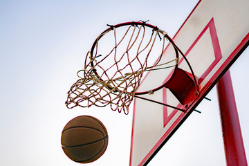ball hit or score the basket, blue sky on the background, success concepts