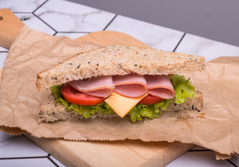 Sandwich with lettuce, tomato, ham and cheese,breakfast