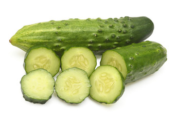 Cucumber slices isolated on white background. Top view, flat lay